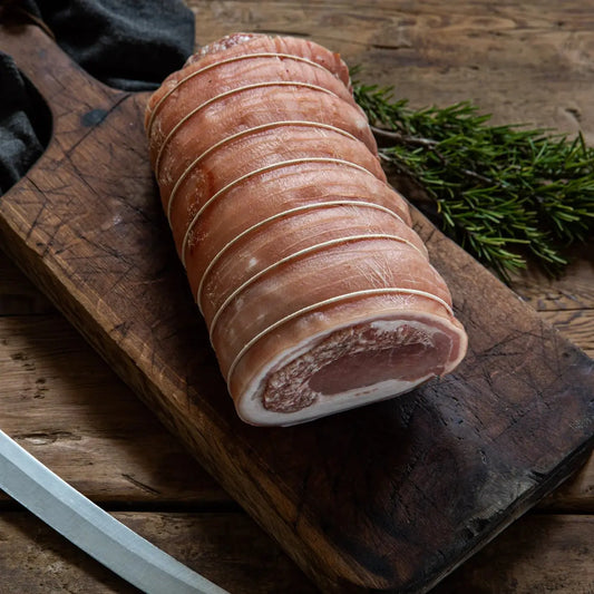 Porchetta—rolled, rind-on pork with fennel, garlic and rosemary. Start hot for crisp crackling, then roast gently for juicy slices. Oven or BBQ/rotisserie. Order online from Uncle Beef.