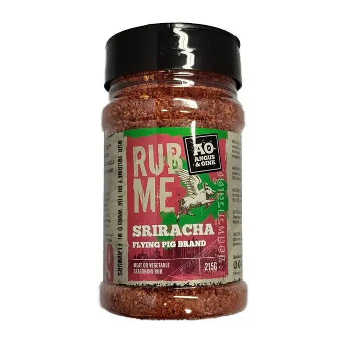 Angus & Oink Sriracha seasoning tub beside spicy glazed wings with lime and sesame