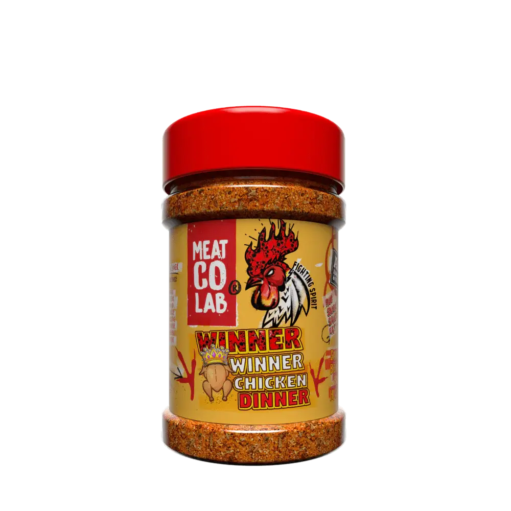 Angus & Oink Winner Winner Chicken Dinner seasoning tub beside golden roasted chicken thighs with lemon and herbs