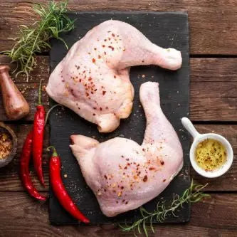 Raw bone-in, skin-on chicken legs ready for roasting – Uncle Beef Butchers