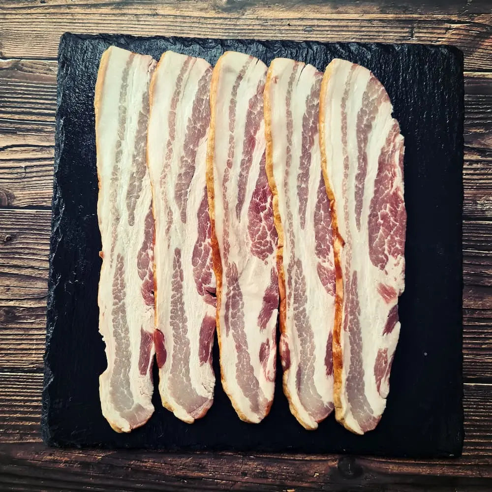 Dry cured streaky unsmoked bacon fried until evenly crisp with golden edges, ready for a BLT or full English