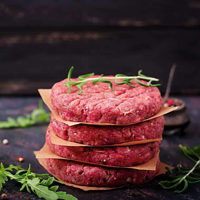 Lamb burger patties seared on a hot griddle with a caramelised crust – Uncle Beef Butchers