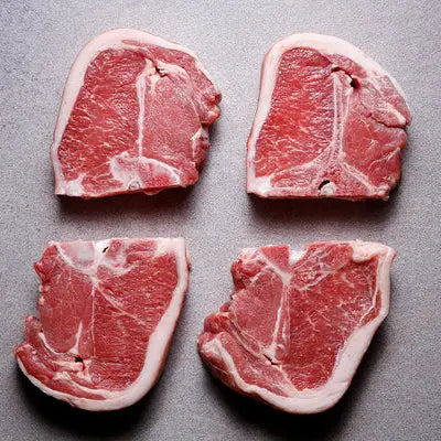 Lamb loin chops seared to a golden crust with rosemary and butter, resting before serving – Uncle Beef Butchers