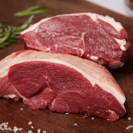 Lamb rump roasted to a blushing centre with golden fat cap, sliced across the grain – Uncle Beef Butchers