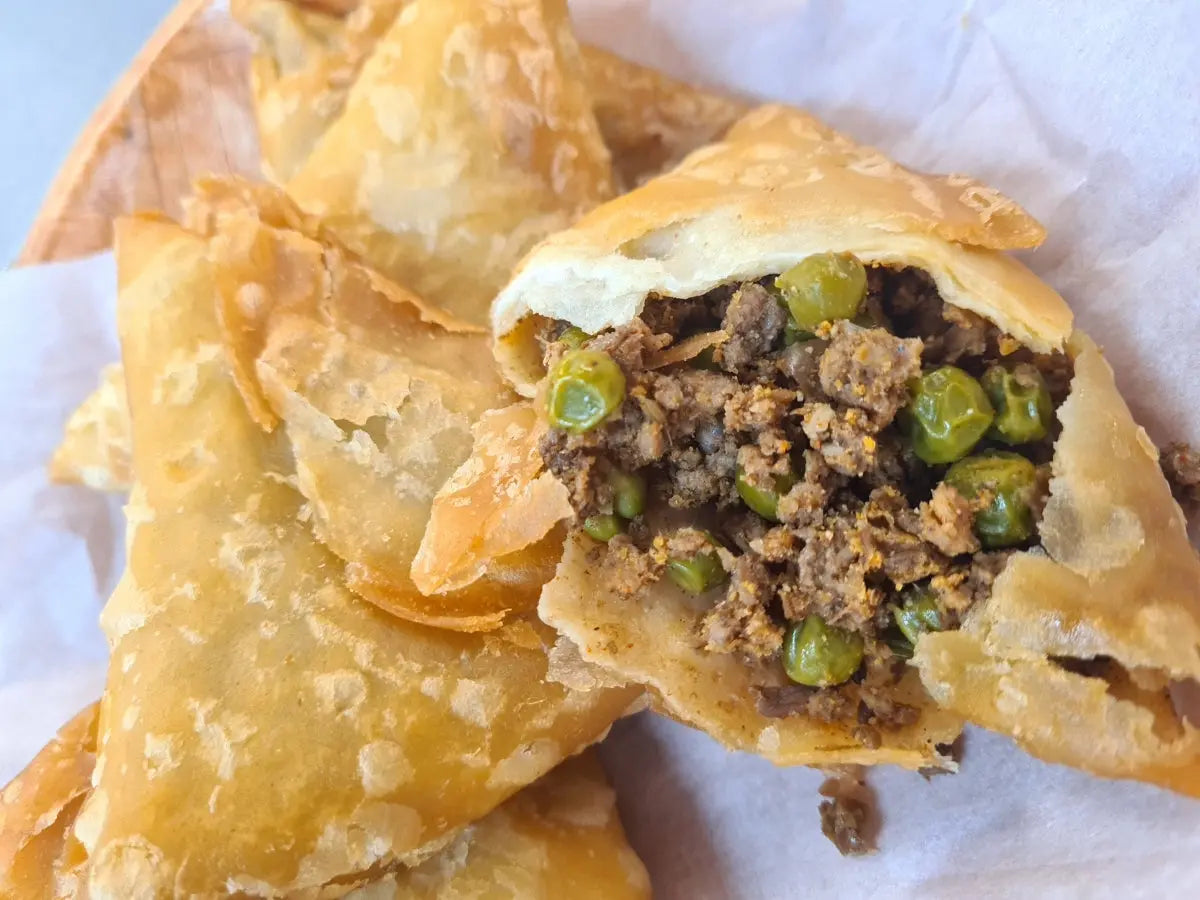 Crispy golden lamb samoosas with a spiced lamb filling, served with mint yoghurt and mango chutney