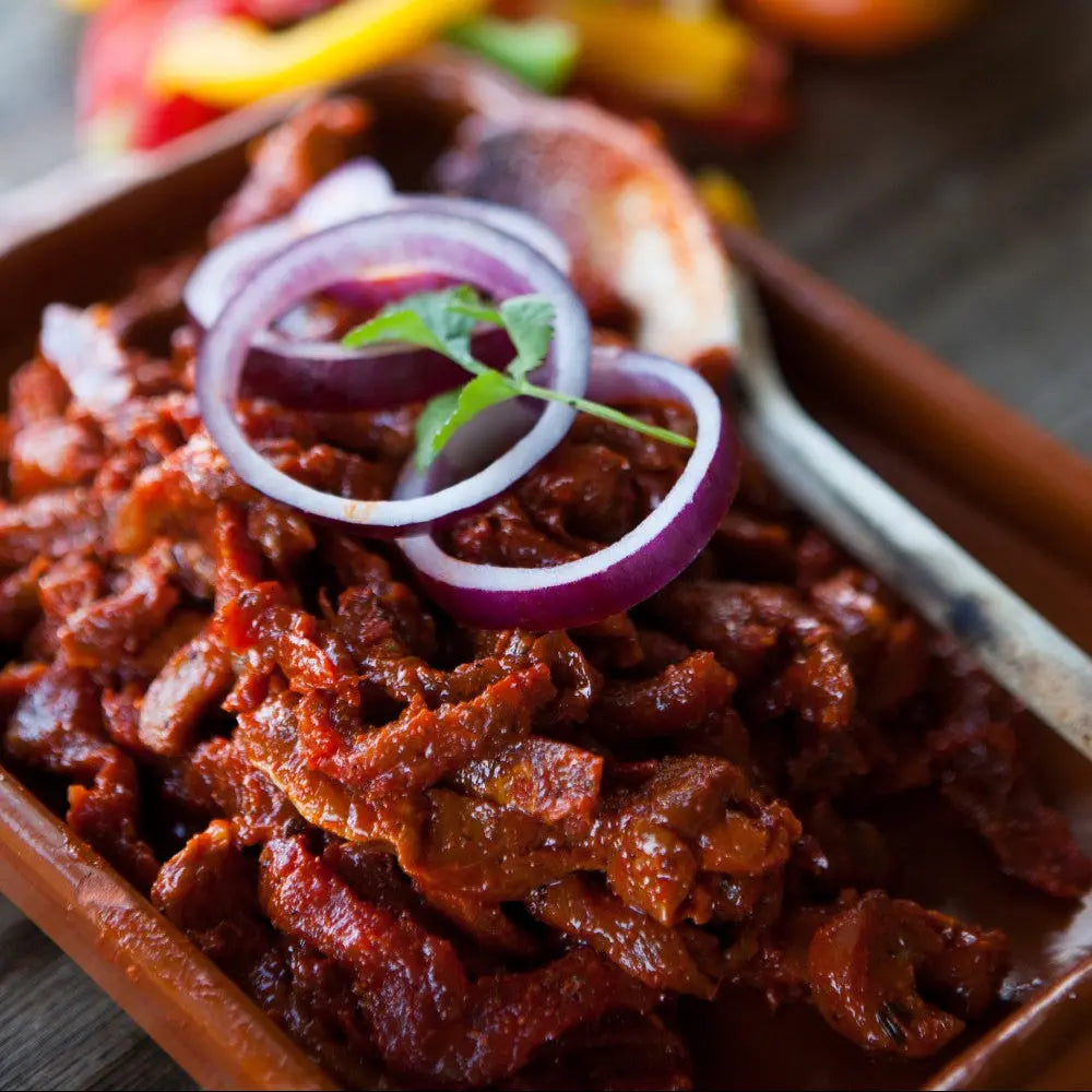 Mexican chilli beef stir-fry strips sizzling in a pan with peppers – Uncle Beef Butchers