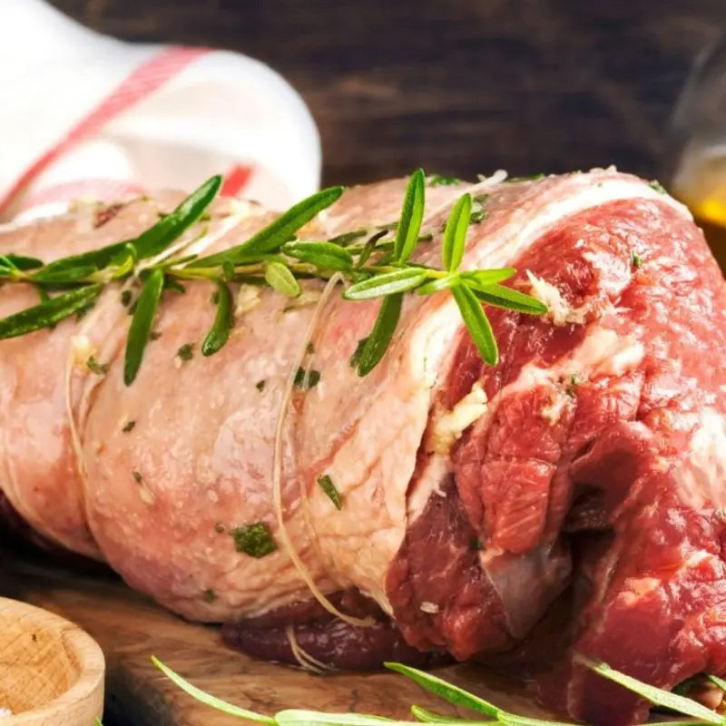 Rolled lamb rump with golden fat cap, roasted to a blushing centre and sliced across the grain – Uncle Beef Butchers