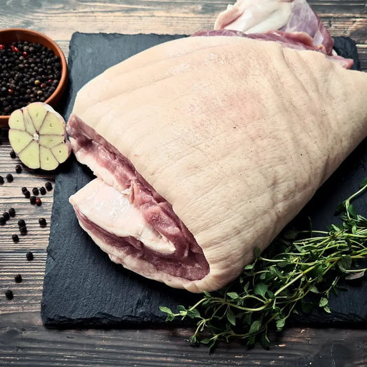 Whole pork belly roasted with blistered crackling, sliced to reveal juicy layers – Uncle Beef Butchers